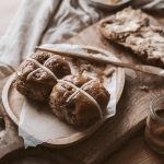 brown bread buns on wooden plate
